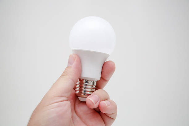 istock Energy lamp in a person's hand. 1352781929
