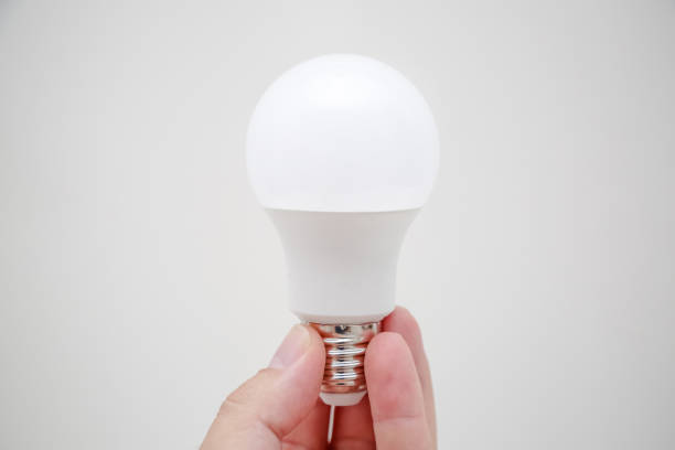 istock Energy lamp in a person's hand. 1352781940