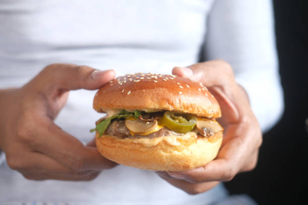 istock hungry man waiting for eating beef burger 1352784036