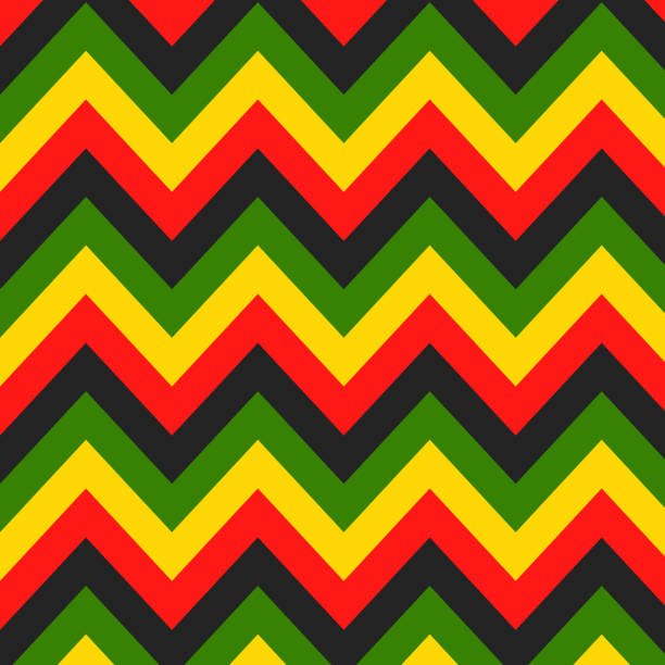 ямайский цвет зигзагообразный бесшовный рисунок. шеврон растафариан на фоне классических цветов раста-регги. векторная иллюстрация обоев. - reggae stock illustrations