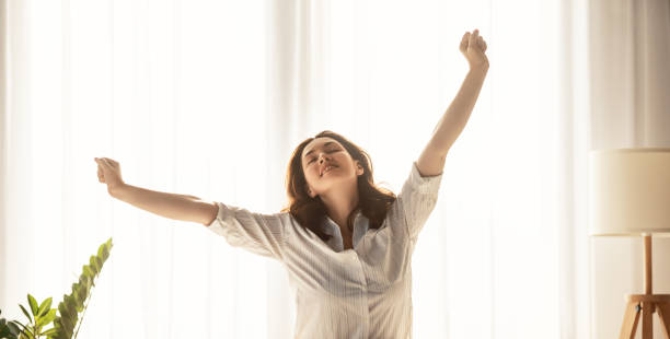 istock woman enjoying sunny morning 1352791760