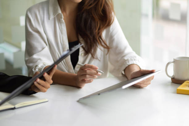 istock During the meeting, a businesswoman was using a touchpad. 1352792806