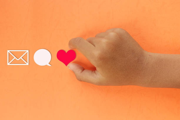 istock horizontal close view hand is picking heart icon 1352794528