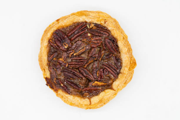 istock Small Pecan Pie Tart on a White Background 1352797923