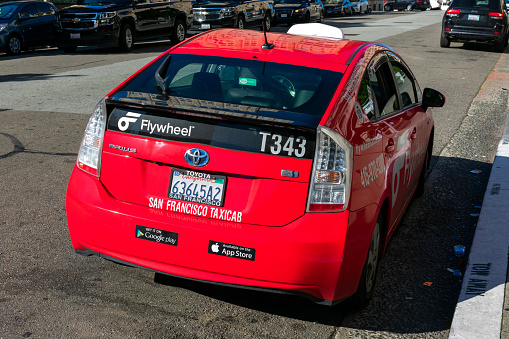 San Francisco Taxicab sign on the bumper of Flywheel taxi vehicle - San Francisco, California, USA - 2021