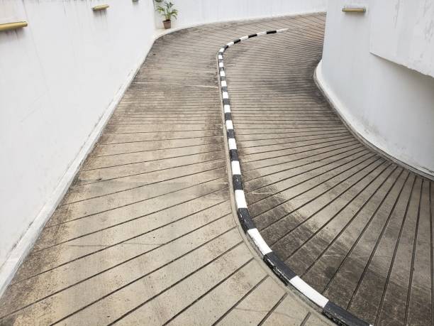 istock a ramp down to the basement in an office building 1352800727