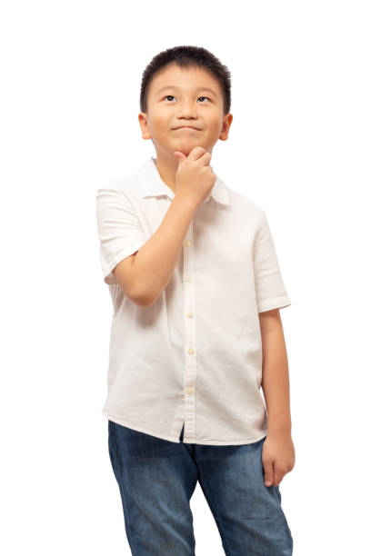 istock Kid looking up and thinking with hand on chin 1352800792