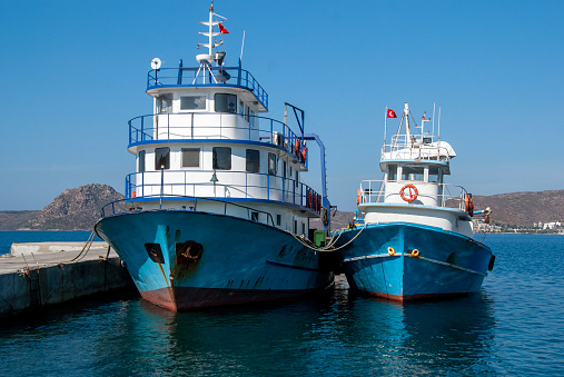 Two Fishing Trawlers in a Harbour