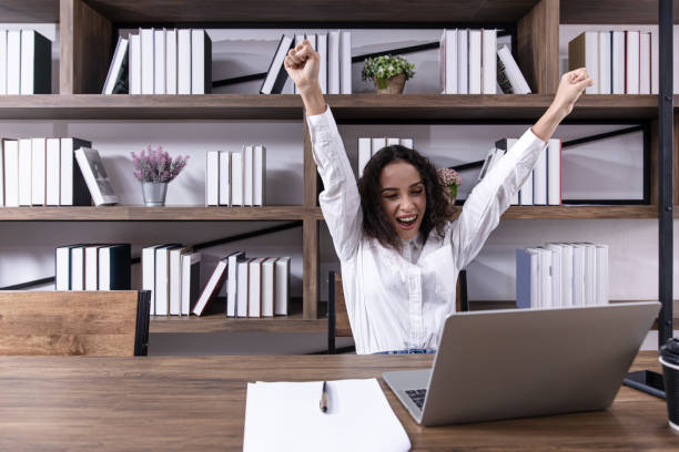 istock happy office women worker employee done or finish working job expression 1352803537