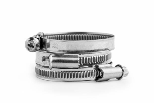 Different metal clamps for hose connection isolated on white background close up.