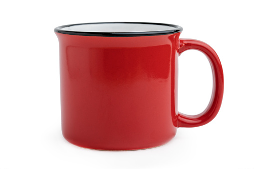 Side view of empty red enamel coffee mug isolated on white background