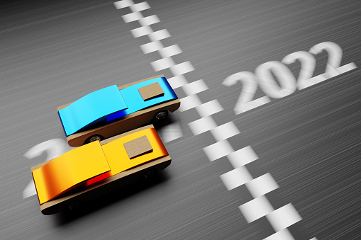 3D illustrations of car races with children's cars, the inscription 2022 on the road.Changeability of years 2021, 2022. he concept of New Year and Christmas in the automotive field.