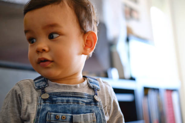 istock A little one-year-old boy close-up portrait. 1352811702