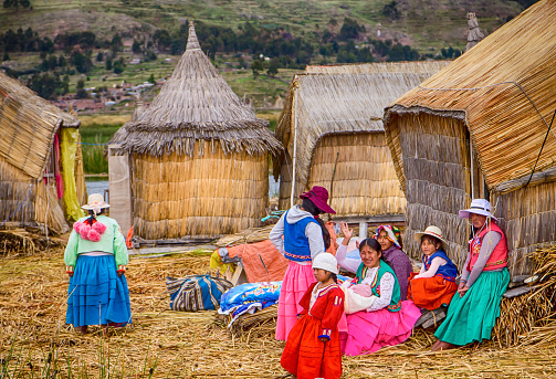 Floating village family Island Titicaca Lake, Puno, Peru