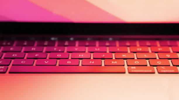 istock close-up laptop keyboard with red light. Turkish alphabet keyboard. copy space. 1352814332