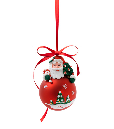 Christmas Ball hanging with red ribbon and bow isolated on white background.