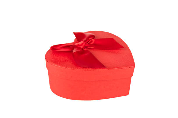 istock red heart shaped gift box with red bow isolated 1352816709