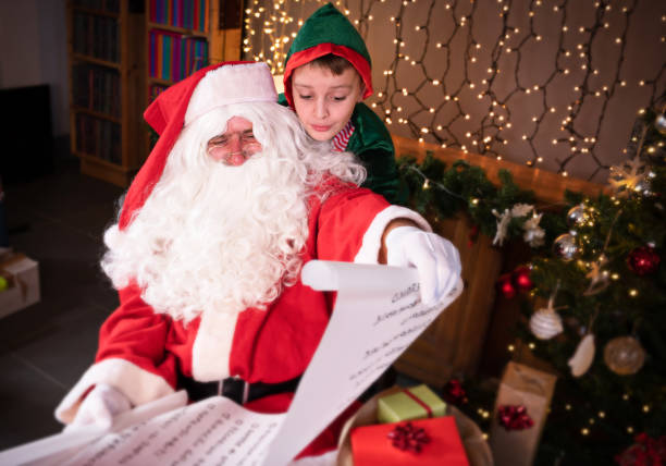 istock Elf, Santa and Wish list 1352818150
