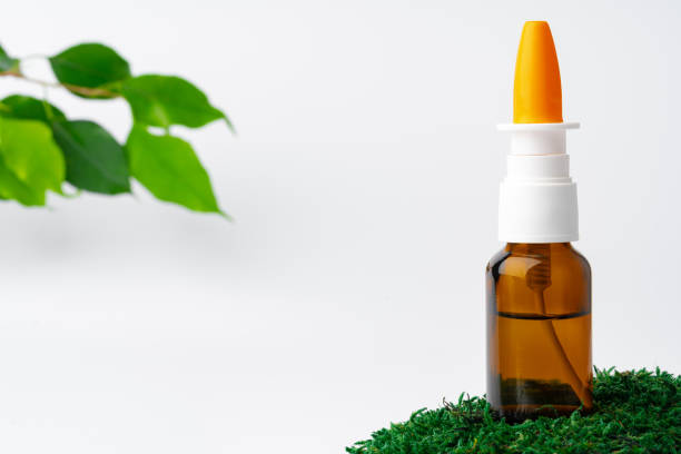 istock Cosmetics in a bottle, essential oil on moss 1352820132