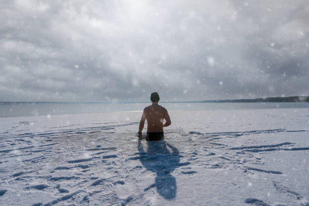 istock Ice bath in a frozen lake 1352821512