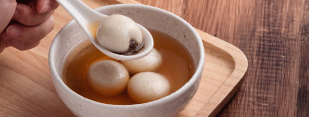 istock Sesame big tangyuan with syrup soup. 1352822200