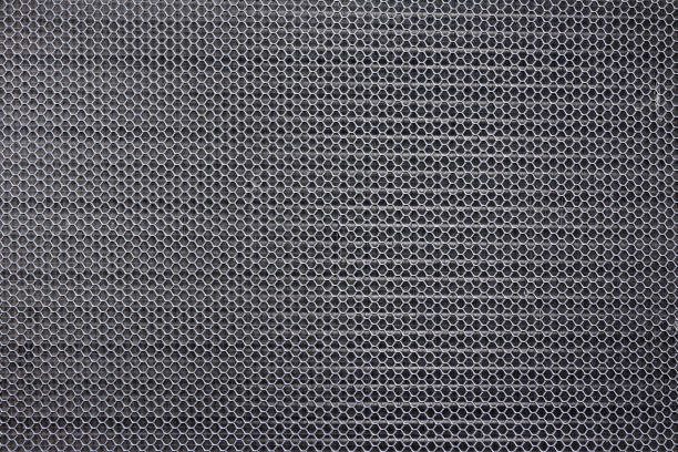 istock Hexagonal braided silver stainless steel background image 1352822225