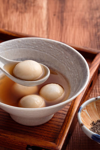 istock Sesame big tangyuan with syrup soup. 1352822880