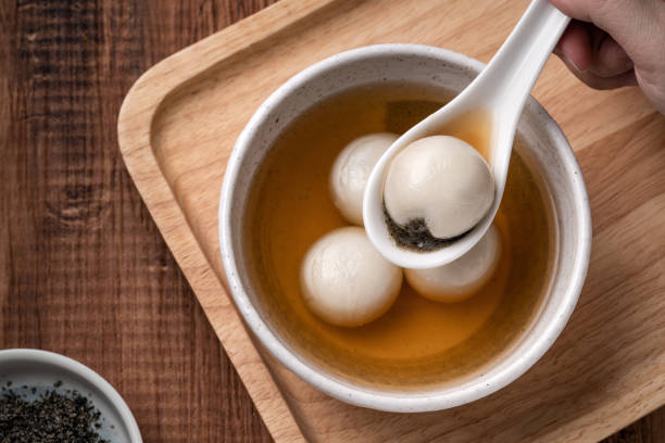 istock Sesame big tangyuan with syrup soup. 1352822930
