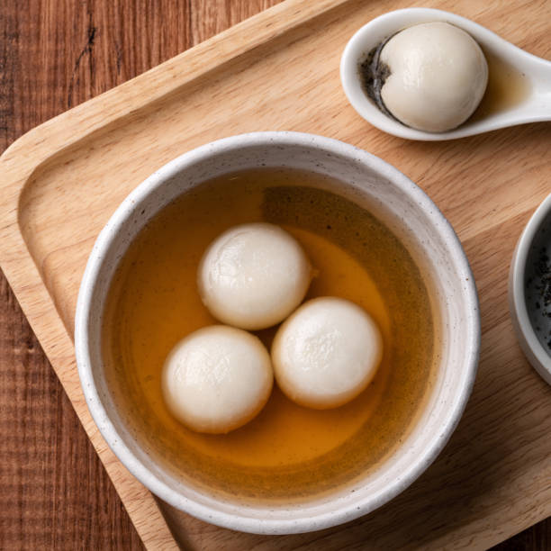istock Sesame big tangyuan with syrup soup. 1352823014