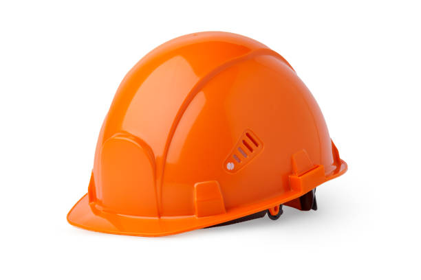 istock Orange plastic safety helmet isolated on white background 1352824047