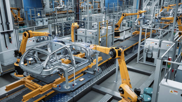 istock Car Factory 3D Concept: Automated Robot Arm Assembly Line Manufacturing Advanced High-Tech Green Energy Electric Vehicles. Construction, Building, Welding Industrial Production Conveyor. 1352825084