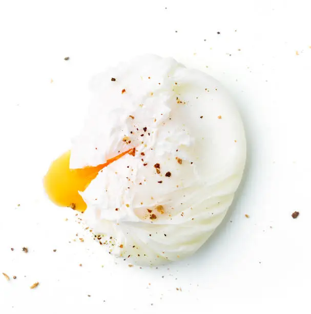 Photo of Poached egg isolated on white background, from above