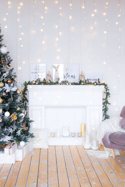 istock Christmas tree with presents underneath in living room 1352828151