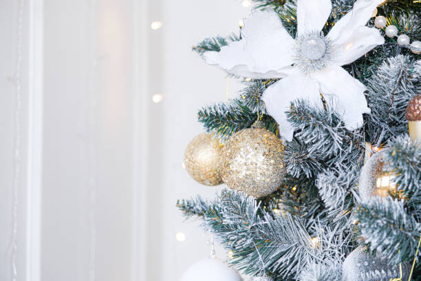 istock Closeup Christmas tree background, selective focus, high key 1352828181