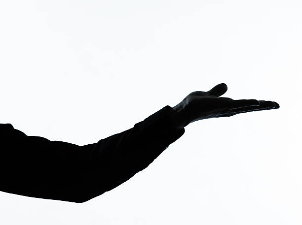 istock close up detail one man silhouette empty hand open 135283096