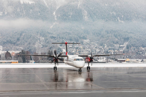 istock Airplane starting engines with snow winter background 1352831828