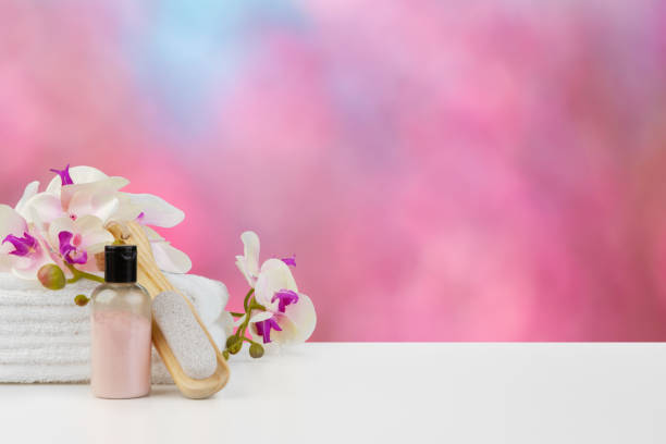 istock Towels with flowers on light table against blurred background 1352832236