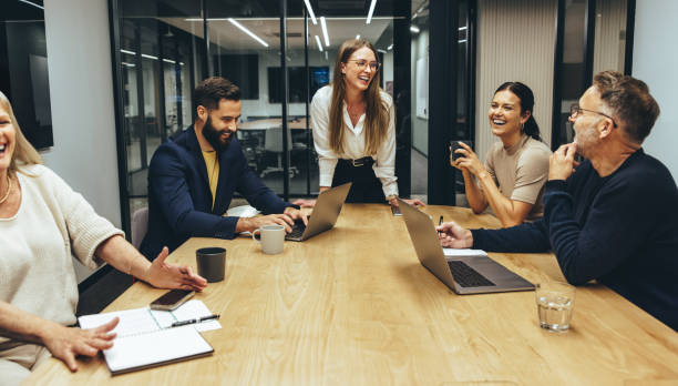 istock Colleagues laughing during a meeting 1352833318