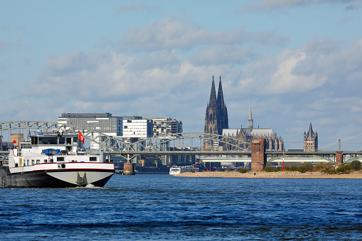 Cargo ship shortly before Cologne sails down the Rhine river