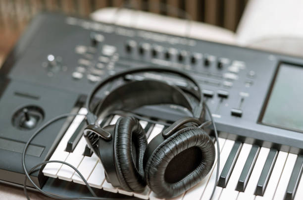 istock headphones on a synthesiser 1352833843