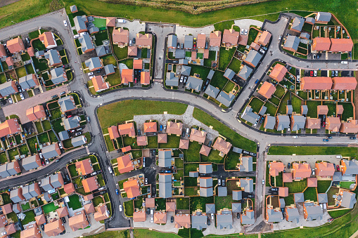 Aerial top down view of houses in England - New estate with typical British houses and green gardens - Real estate and buildings concepts in UK