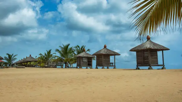 View of the beach with bungalow house where you can sit and admire the sea. Photo taken in Keta Ghana West Africa
