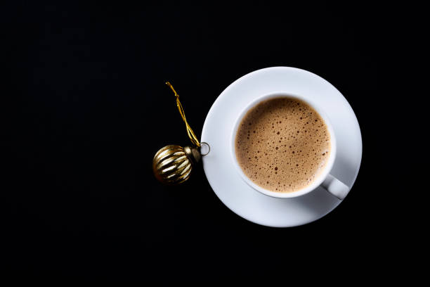 istock Cup of coffee on black background. Directly Above. Copy space. 1352835912