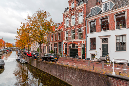 Amsterdam, the Netherlands - October 14, 2021: Canals and typical dutch architecture in Haarlem, the capital of the province of North Holland, also a part of Amsterdam metropolitan area.