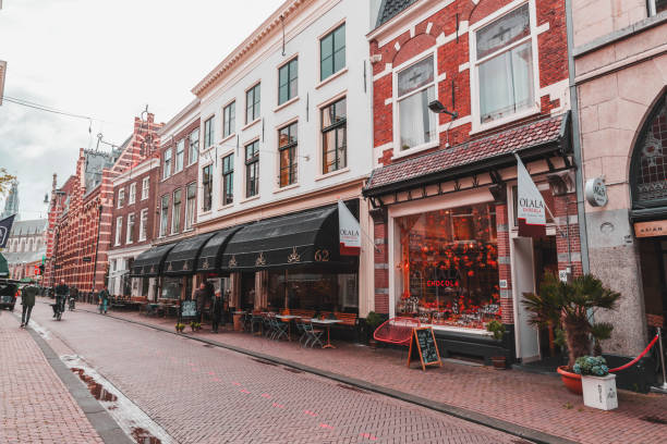 Haarlem, the Netherlands - October 13, 2021: Street view and generic architecture in Haarlem with typical Dutch style buildings.