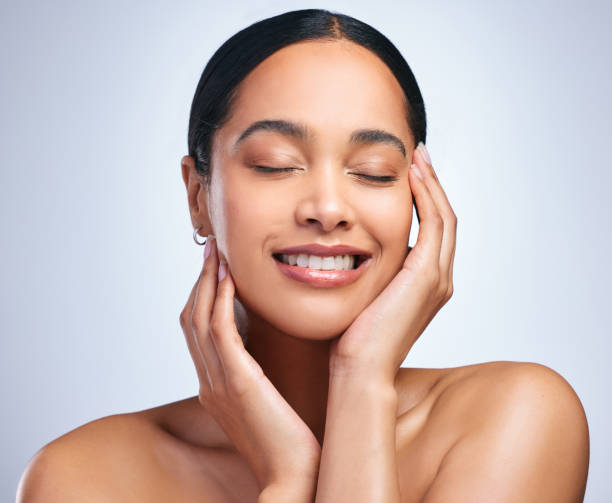 Shot of a beautiful young woman posing against a grey background Keep loving me, it's all I know how to do beauty treatment relaxation women carefree stock pictures, royalty-free photos & images