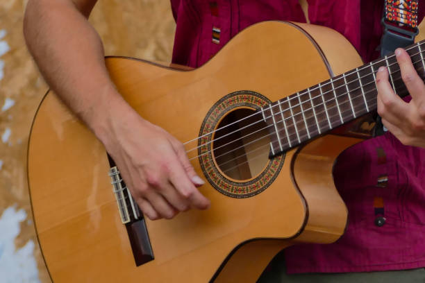 istock Person playing music outdoors 1352840065