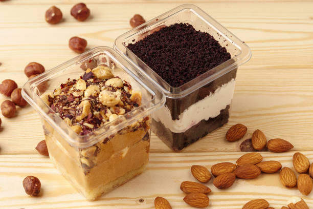 istock Creamy dessert in a plastic box on wooden table 1352842082
