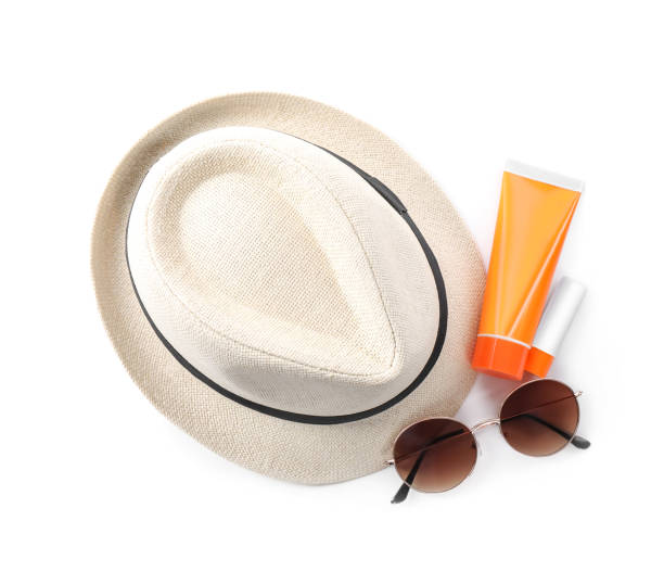 istock Sun protection products, sunglasses and hat on white background, top view. Beach objects 1352842789