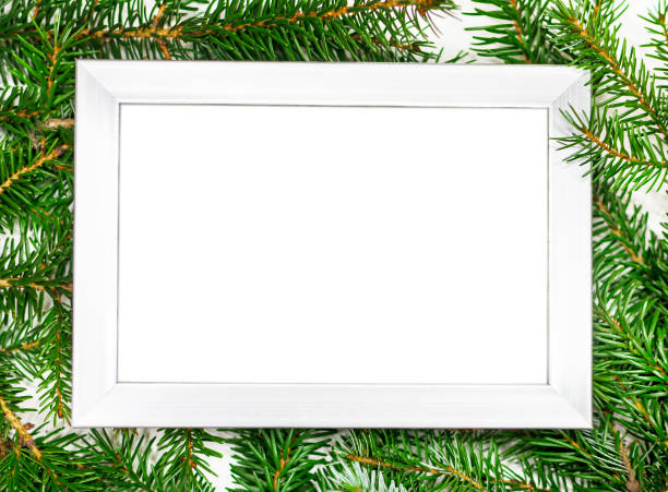 istock Festive background of Christmas fir branches and white frame 1352843108